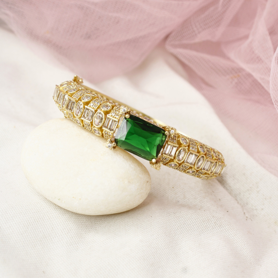 Regal Gold-Plated Kada with Emerald Green Stone & Baguette Diamonds