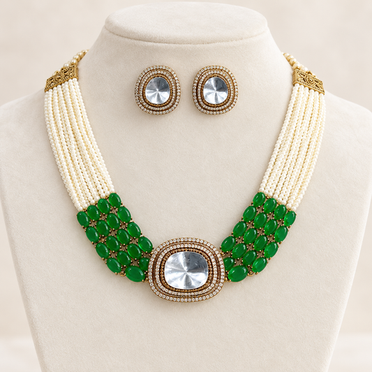 Navraee Elegant Necklace Set with pearl strands, green accents and matching earrings on an ivory display bust