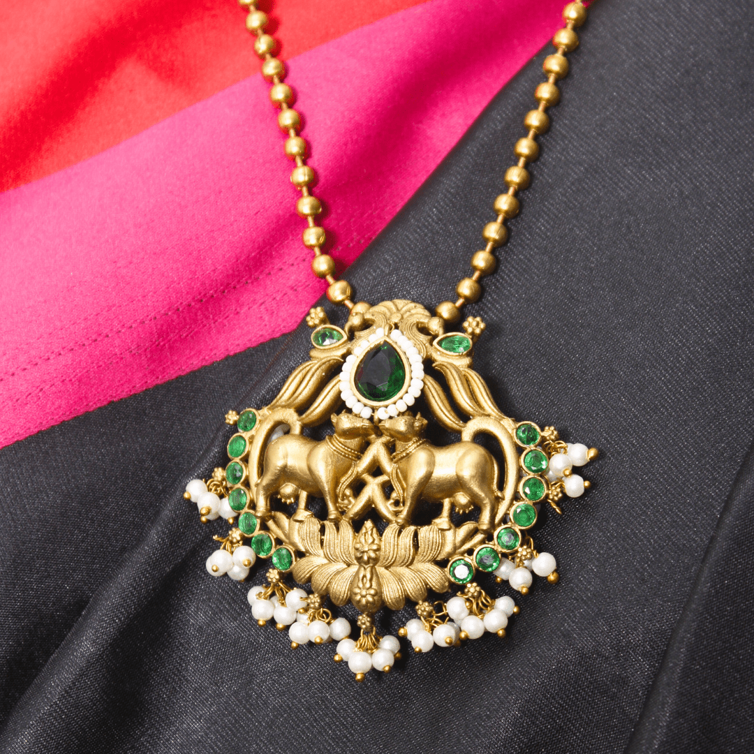 Nandi Pair Antique Pendant Set – Matte Gold with Emerald Green Kundan & Pear