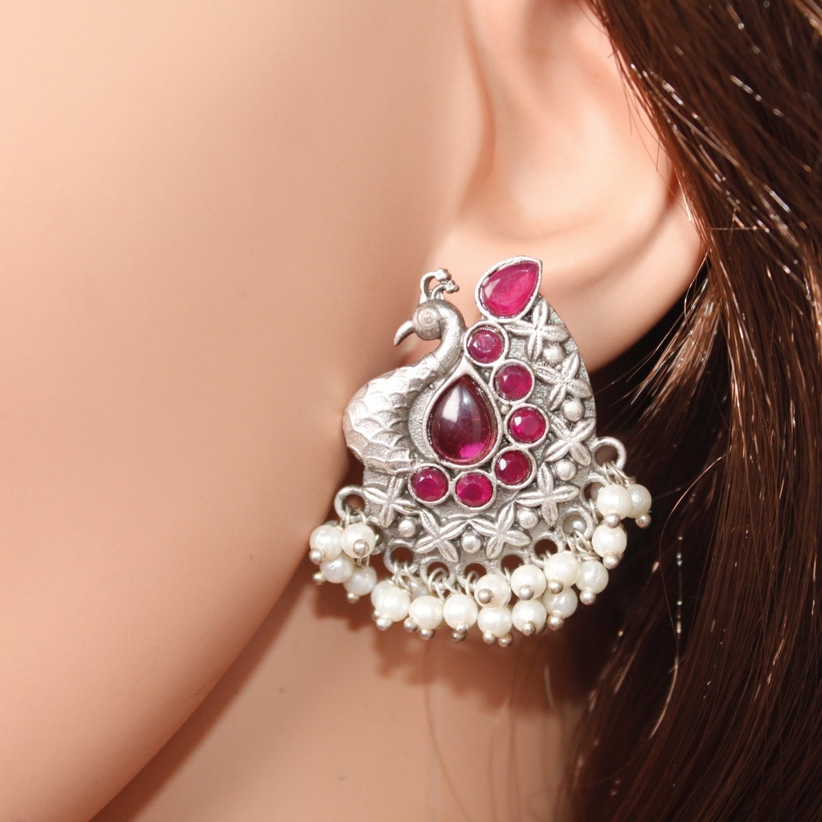SILVER LOOK ALIKE PEACOCK STUDS - RED