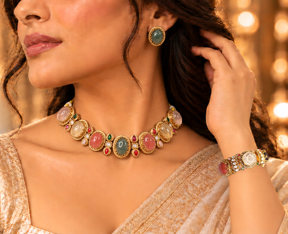 Model wearing an oval multicolour stone necklace, green studs and the original matching multicolour kada.