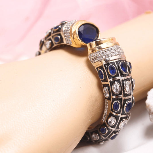 Blue and white meenakari kada detail for Navraee styling and care guide