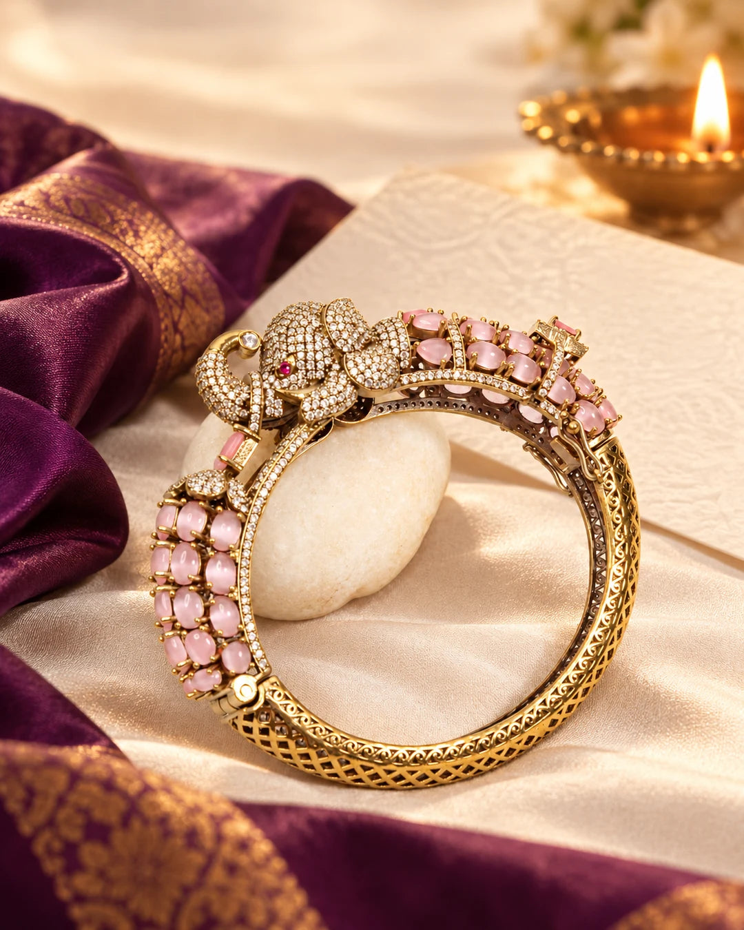 Navraee pink elephant-motif kada in a warm Diwali gifting setting