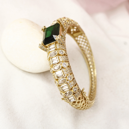 Regal Gold-Plated Kada with Emerald Green Stone & Baguette Diamonds