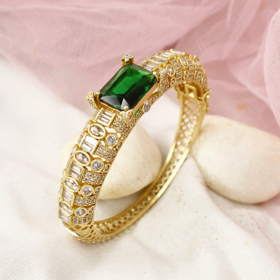 Regal Gold-Plated Kada with Emerald Green Stone & Baguette Diamonds