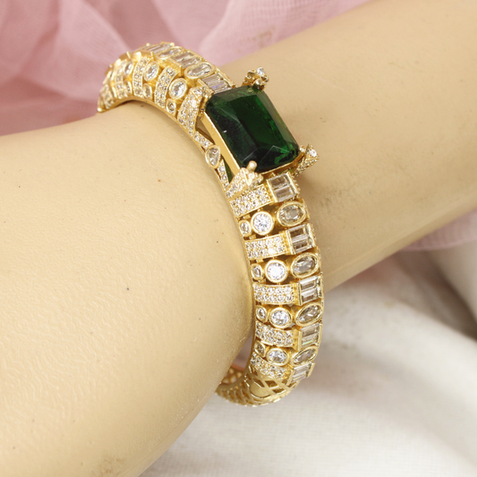 Regal Gold-Plated Kada with Emerald Green Stone & Baguette Diamonds