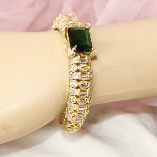 Regal Gold-Plated Kada with Emerald Green Stone & Baguette Diamonds