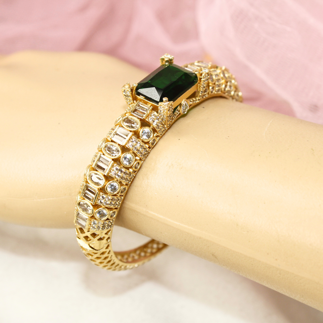 Regal Gold-Plated Kada with Emerald Green Stone & Baguette Diamonds