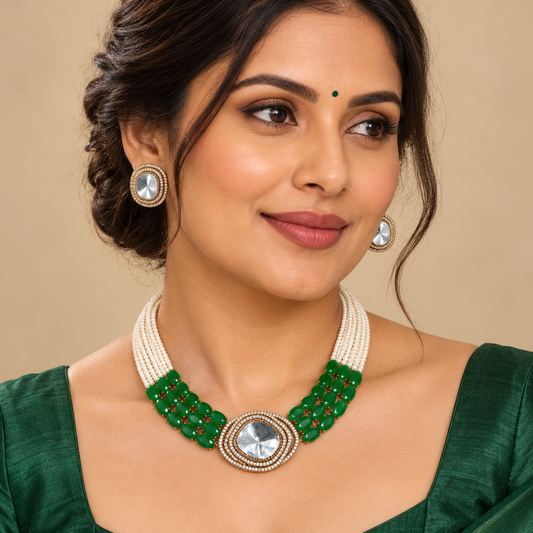 Model wearing Navraee Elegant Necklace Set with green stones, pearl strands and matching earrings