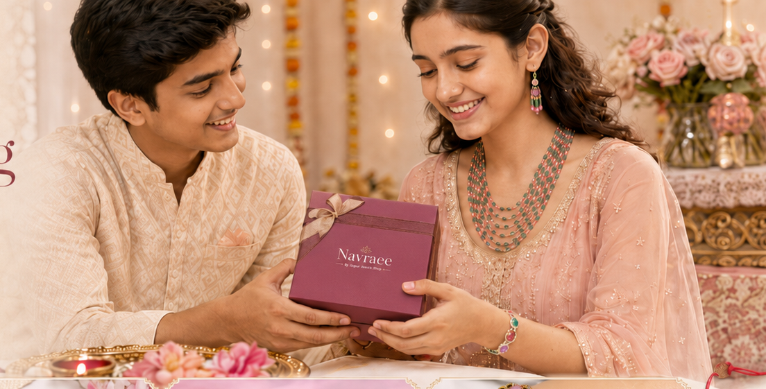 A promotional banner for Navraae Rakhi Gifting, showing a young couple smiling as the girl presents a maroon jewelry box to the boy. Below, four inset images showcase various silver and multicolor Rakhi designs and jewelry pieces.