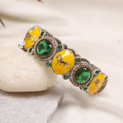 Exclusive Silver Plated Yellow Enamel Animal Motif Kada with Emerald Green Stones