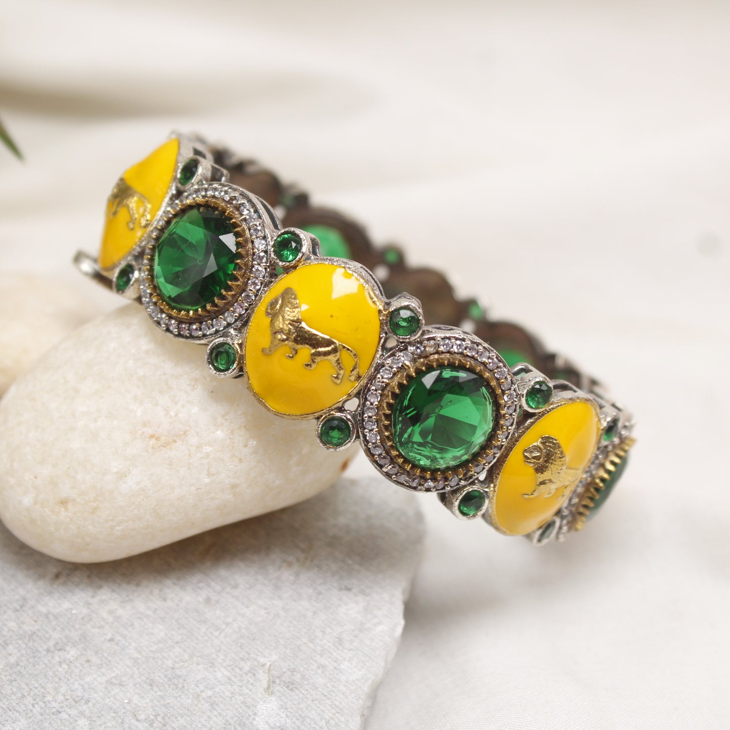 Exclusive Silver Plated Yellow Enamel Animal Motif Kada with Emerald Green Stones
