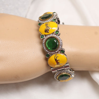 Exclusive Silver Plated Yellow Enamel Animal Motif Kada with Emerald Green Stones