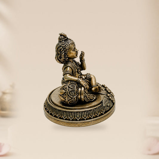 Bal Krishna Brass Idol with Butter Pot — side view on clean hero-derived studio background