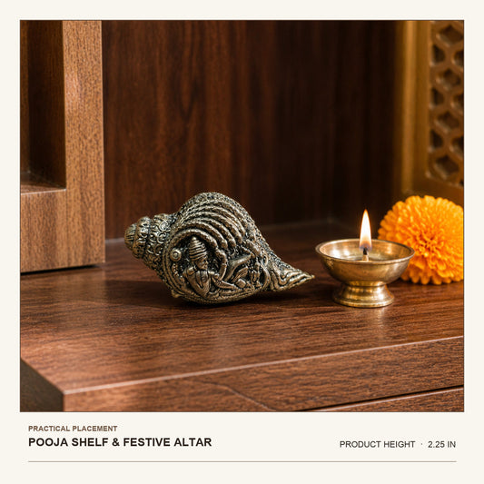 Decorative Brass Conch with Devotional Motifs shown at its 2.25-inch height on a pooja shelf or festive altar