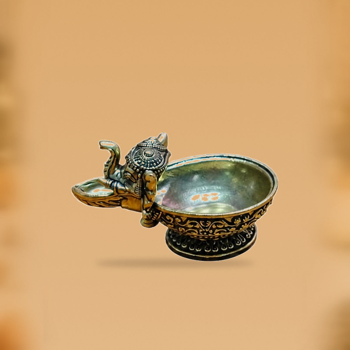 Ganesha Brass Diya Bowl — side view on clean hero-derived studio background