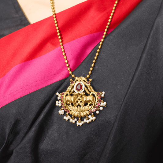 Nandi Divine Antique Pendant Set – Matte Gold with Pink Kundan & Pear