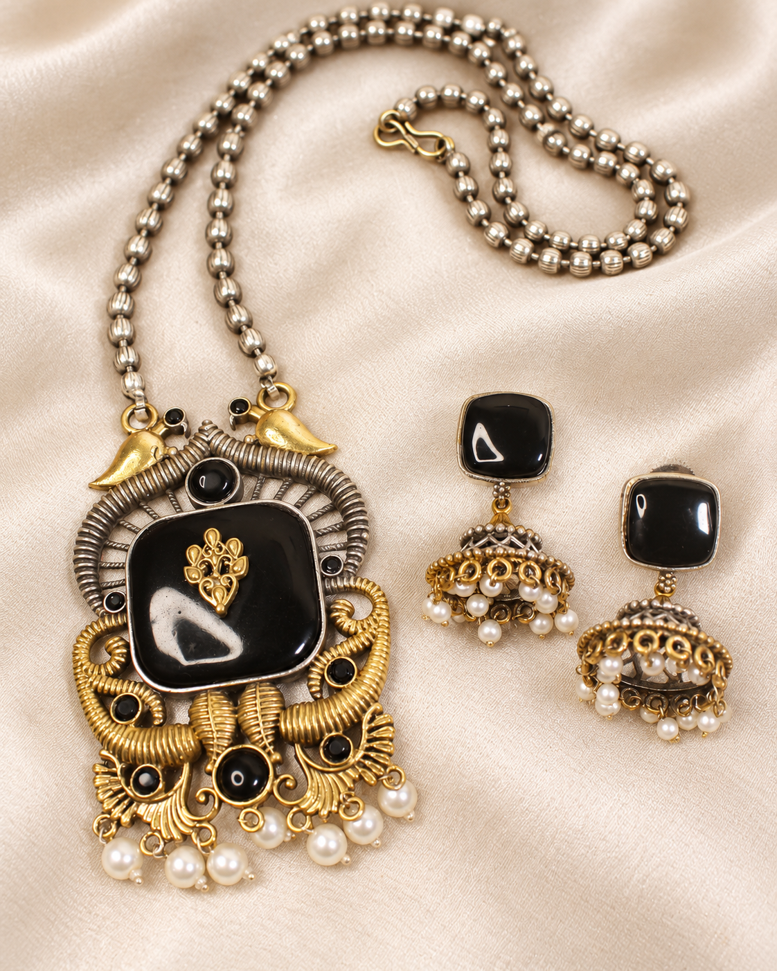 Swan Motif Dual Tone Pendant Set - Black — AI-styled earring detail view