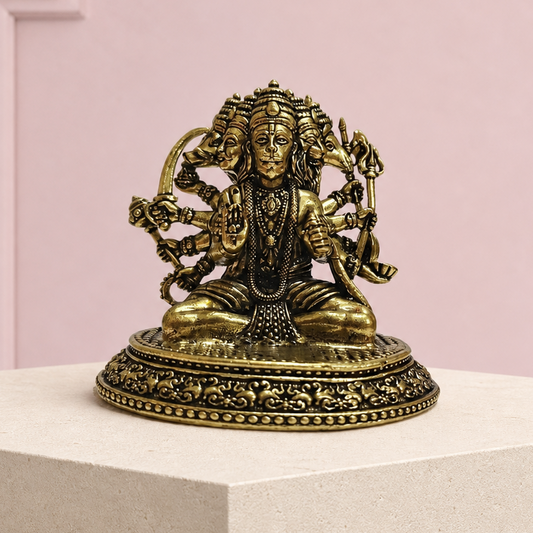 Panchmukhi Hanuman Brass Idol on an ivory platform with a soft mauve heritage backdrop
