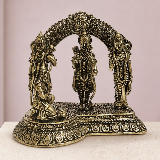 Ram Darbar Brass Idol on an ivory platform with a soft mauve heritage backdrop