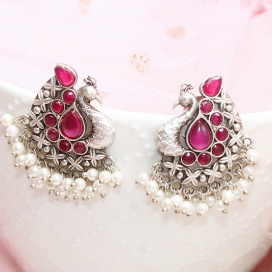 SILVER LOOK ALIKE PEACOCK STUDS - RED