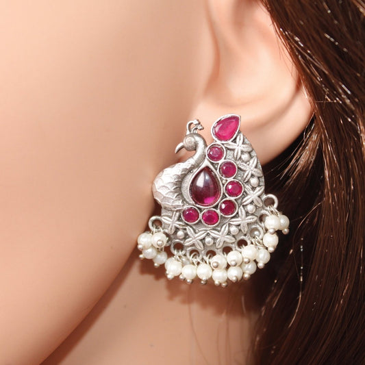 SILVER LOOK ALIKE PEACOCK STUDS - RED