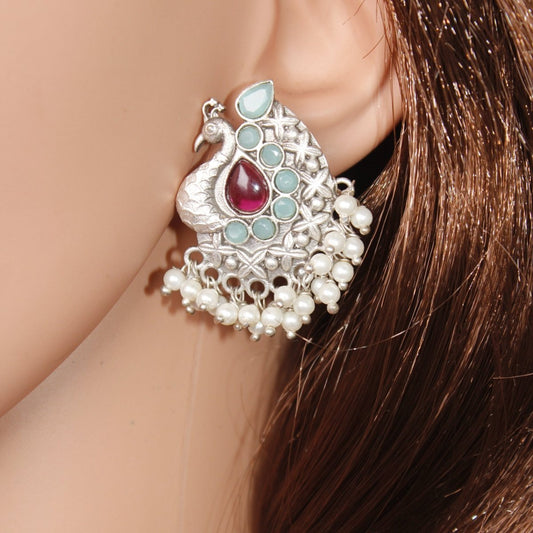 SILVER LOOK ALIKE PEACOCK STUDS-RED & BLUE