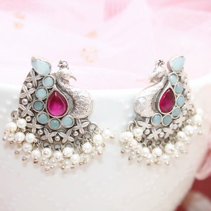 SILVER LOOK ALIKE PEACOCK STUDS-RED & BLUE