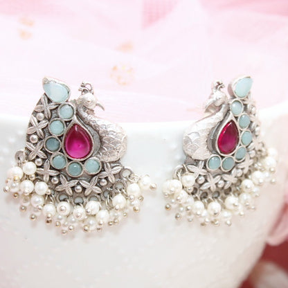 SILVER LOOK ALIKE PEACOCK STUDS - RED & BLUE