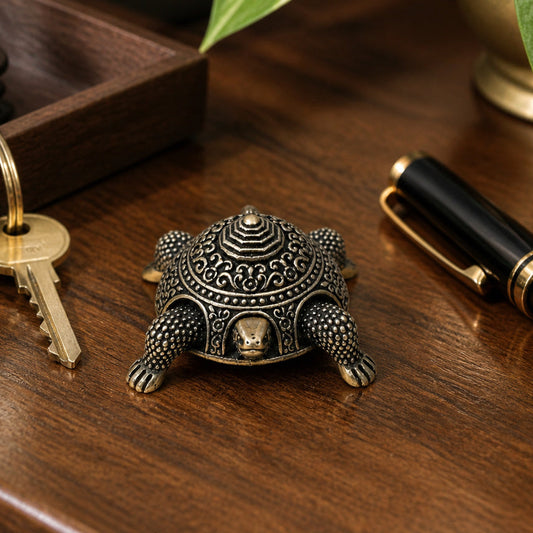 Vastu Tortoise Brass Box shown at its 1.25-inch height on a work desk or entry shelf